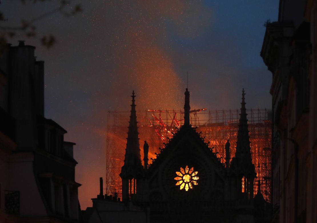 Flames and smoke rise from Notre Dame Cathedral as it burns in Paris.