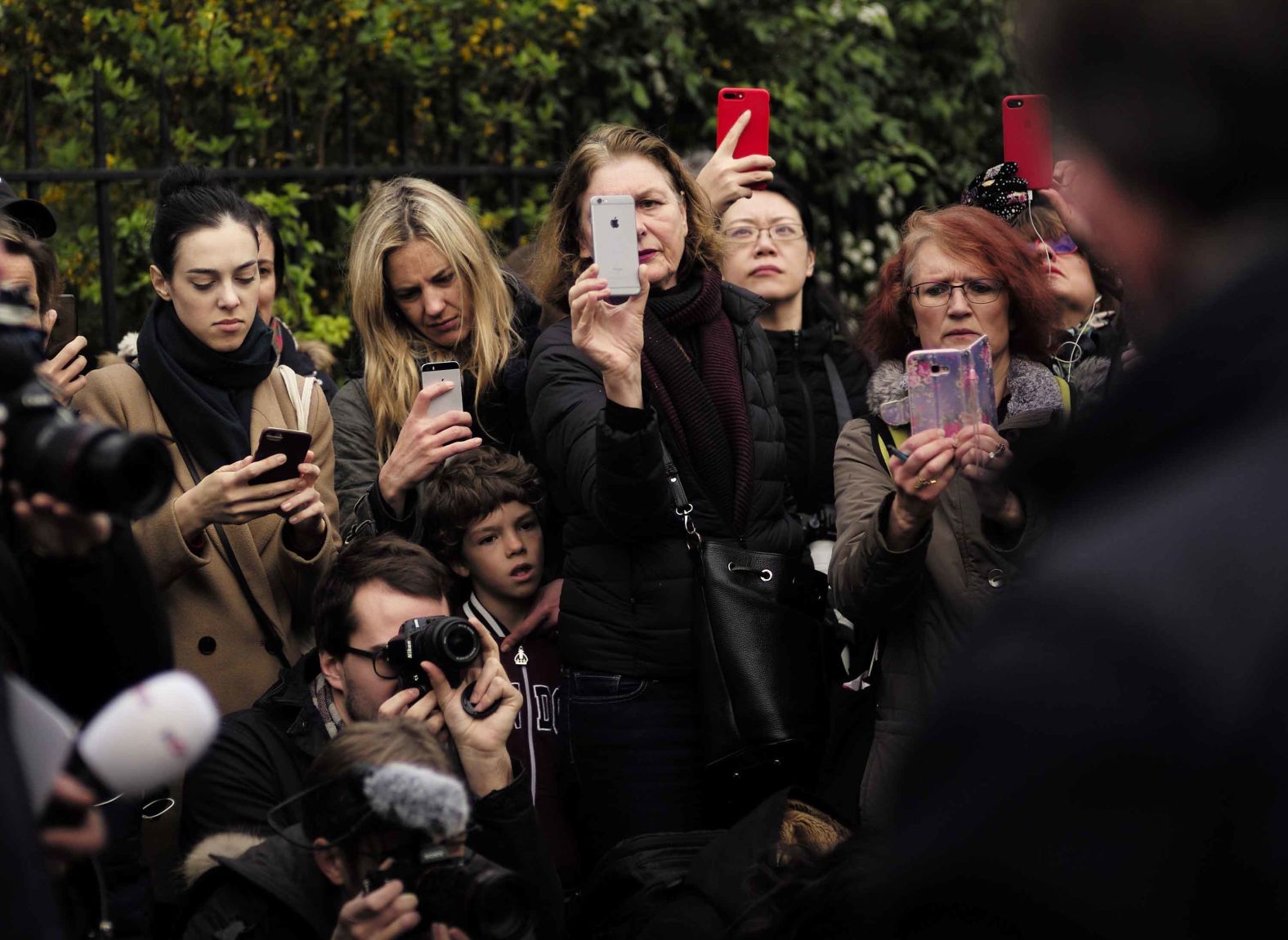 People take photos at the scene on April 16, 2019.