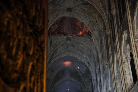 The interior of the cathedral roof is seen smoldering.