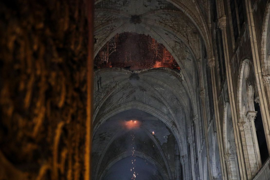 The smoldering roof of the cathedral overnight. 