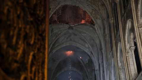 The smoldering roof of the cathedral overnight. 