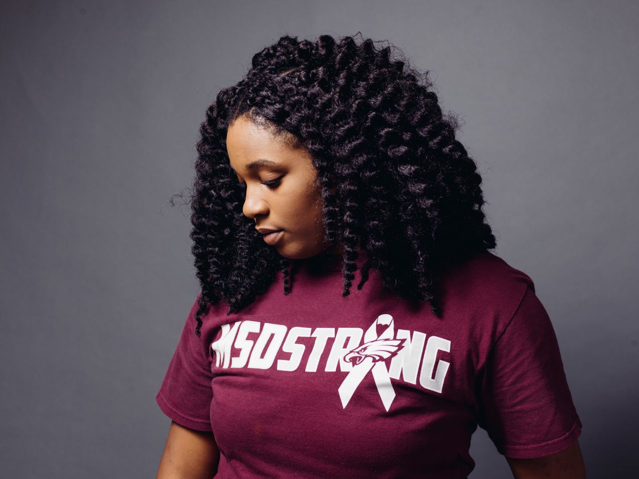 Mei-Ling Ho-Shing, now a senior at Marjory Stoneman Douglas High School, was on the second floor of the school when the shooting started. She could smell the gunsmoke and hear the screams of classmates. When police entered her classroom, they had their guns drawn. As an African American, Mei-Ling says, "It was trauma on top of trauma."