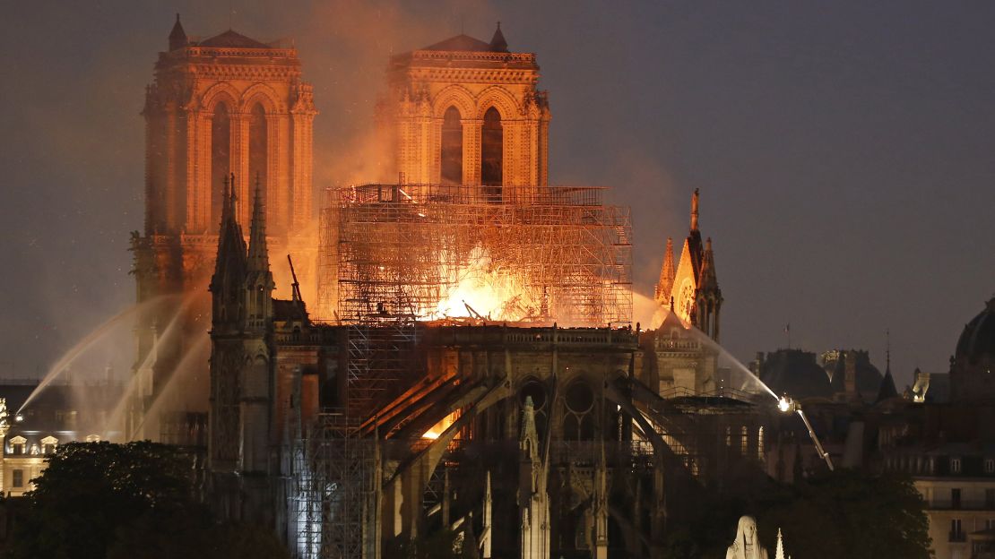 Fire caused Notre Dame's spire to collapse as people watched on horrified. 