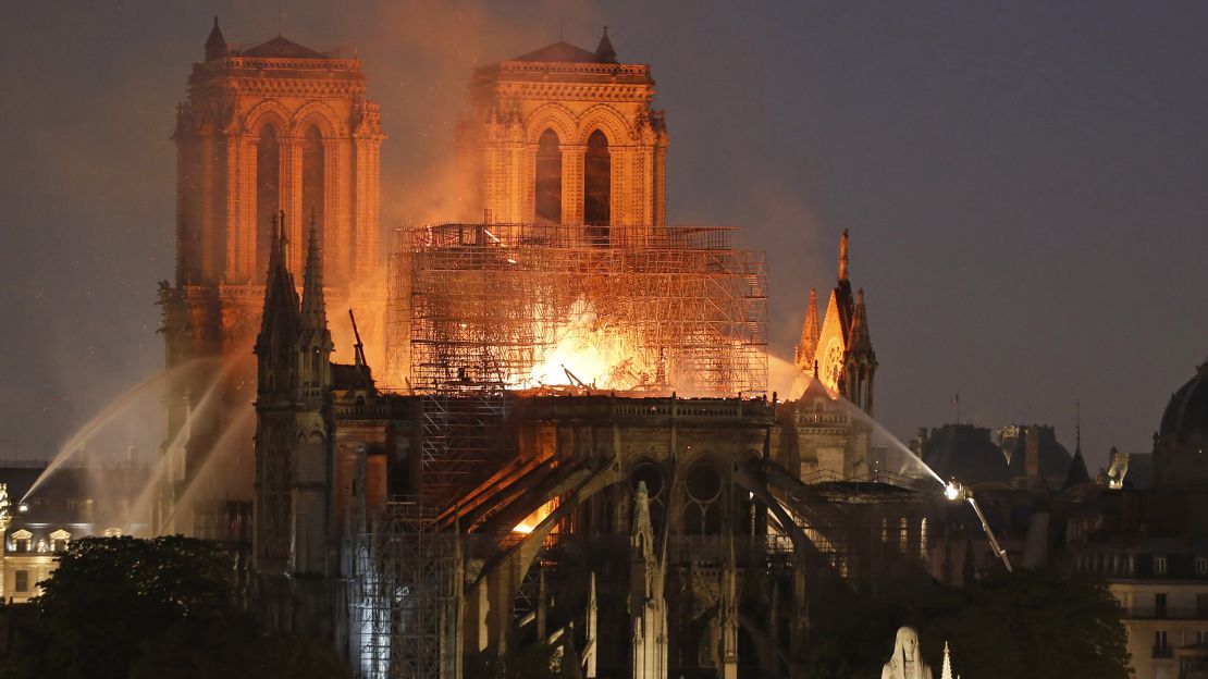 Fire caused Notre Dame's spire to collapse as people watched on horrified.