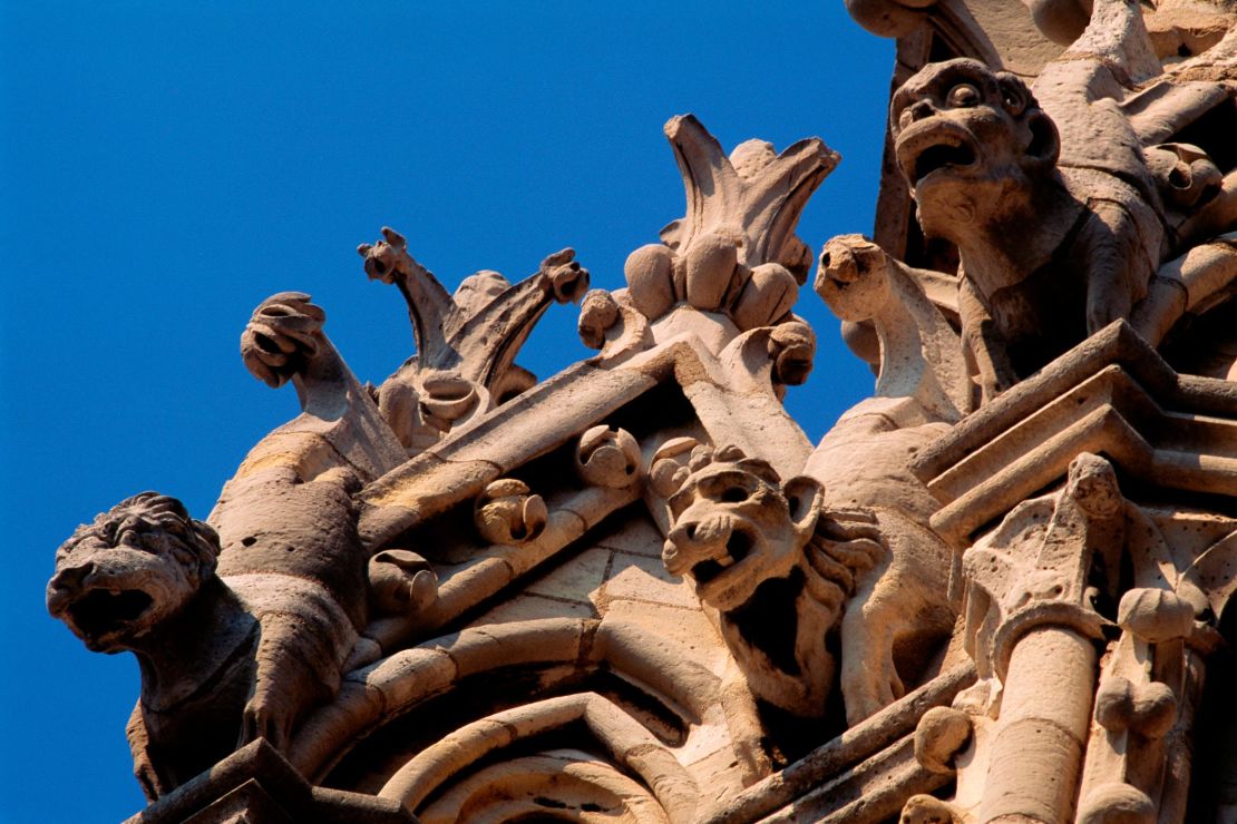 Gargoyles perched upon the north tower of the Notre Dame Cathedral in Paris.