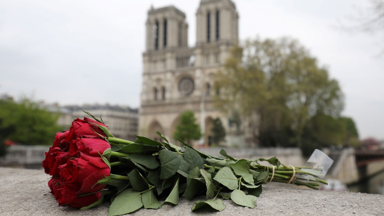 Roses have been laid near Notre-Dame-de Paris Cathedral a day after a fire devastated the cathedral in central Paris on April 16, 2019.
