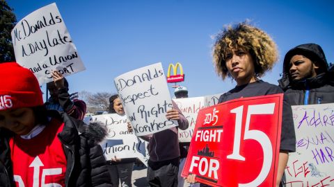 Detroit resident Betty Killingsworth stands with a few dozen cooks and cashiers marching throughout a McDonald's parking lot in April, demanding a $15 minimum wage.