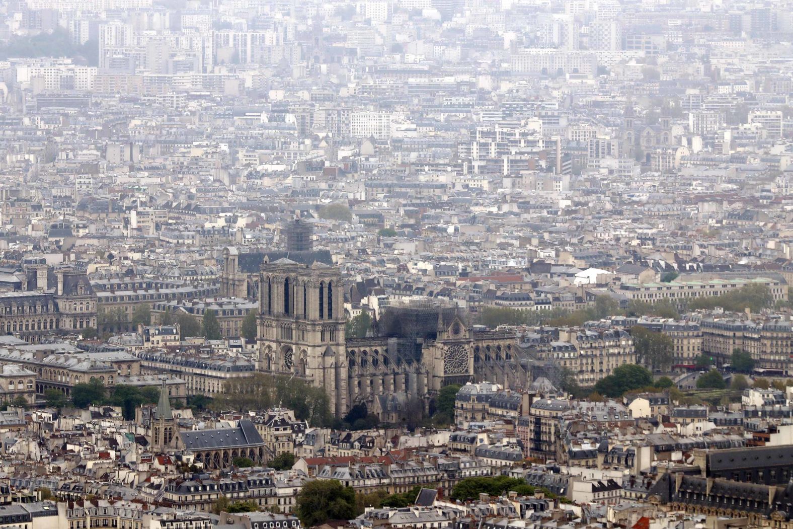 The burnt out cathedral is seen from the top of the Montparnasse tower the day after the fire.
