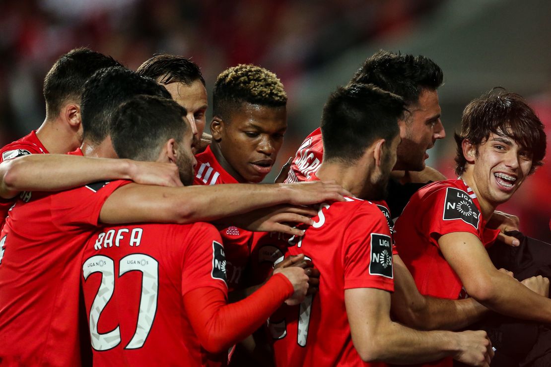 Joao Felix (R) celebrates with his Benfica teammates.