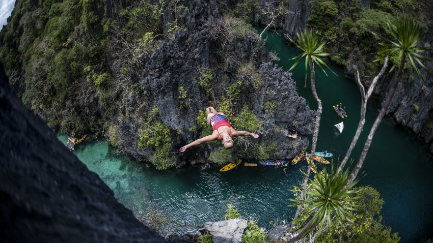 PALAWAN, PHILIPPINES - APRIL 12: (EDITORIAL USE ONLY) In this handout image provided by Red Bull, Rhiannan Iffland of Australia dives from a rock pinnacle at the Small Lagoon on Miniloc Island during the first competition day of the first stop of the Red Bull Cliff Diving World Series on April 12, 2019 at Palawan, Philippines. (Photo by Dean Treml/Red Bull via Getty Images)
