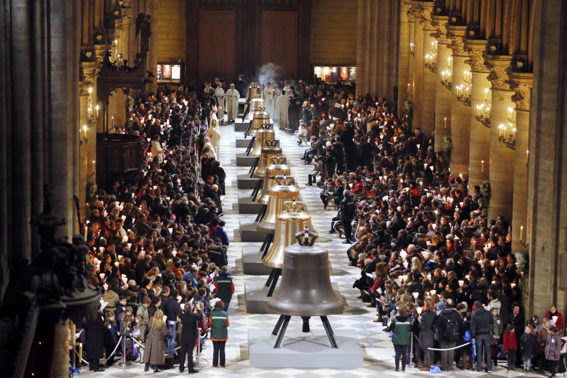 People attend a ceremony to inaugurate nine new church bells at Notre Dame in February 2013. 