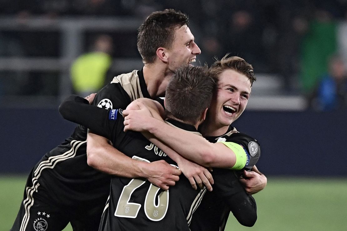 Ajax's Dutch defender Joel Veltman, Ajax's Danish midfielder Lasse Schone and Ajax's Dutch defender Matthijs de Ligt celebrate their team's win over Juventus.