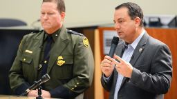 Yuma Mayor Doug Nicholls, right, answers a question during his news conference inside Yuma City Council Chambers about the current humanitarian crisis in the border region due to high volumes of illegal migrant crossing Thursday, March 28, 2019, in Yuma, Ariz. U.S. Border Patrol Deputy Chief Patrol Agent for the Yuma Sector, Carl Landrum, is on the left.  (Randy Hoeft/The Yuma Sun via AP)