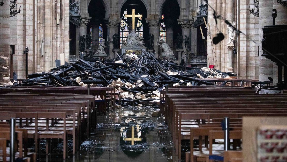 Fallen debris from the burned roof structure sits near the altar inside Notre Dame Cathedral.