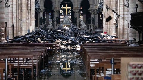 Fallen debris from the burned roof structure sits near the altar inside Notre Dame Cathedral.