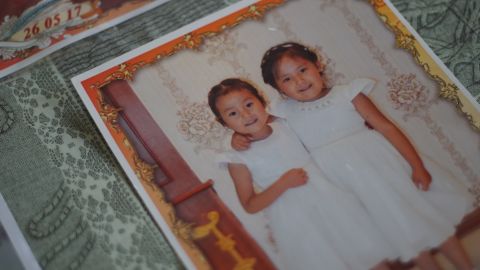 Adbia Hayrat's two daughters, Ansila Esten and Nursila Esten, in a family photo kept by their father.