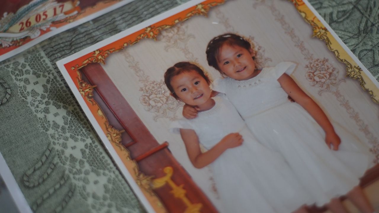 Adbia Hayrat's two daughters, Ansila Esten and Nursila Esten, in a family photo kept by their father.
