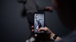 An AFP collaborator poses for a picture using the smart phone application TikTok on December 14, 2018 in Paris. - TikTok, is a Chinese short-form video-sharing app, which has proved wildly popular this year. (Photo by - / AFP)        (Photo credit should read -/AFP/Getty Images)
