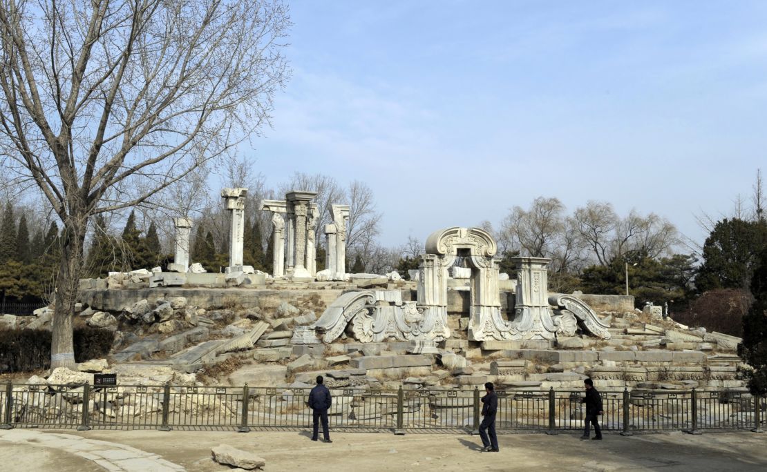 Tourist look at the ruins of the Guanshuifa Fountain which was built in 1759 during the period of Qing Emperor Qianlong, at the Old Summer Palace, also called Yuanmingyuan, in Beijing on February 24, 2009.