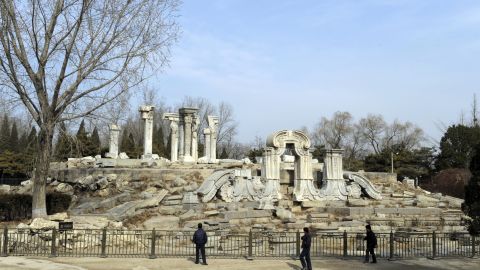 Tourist look at the ruins of the Guanshuifa Fountain which was built in 1759 during the period of Qing Emperor Qianlong, at the Old Summer Palace, also called Yuanmingyuan, in Beijing on February 24, 2009.