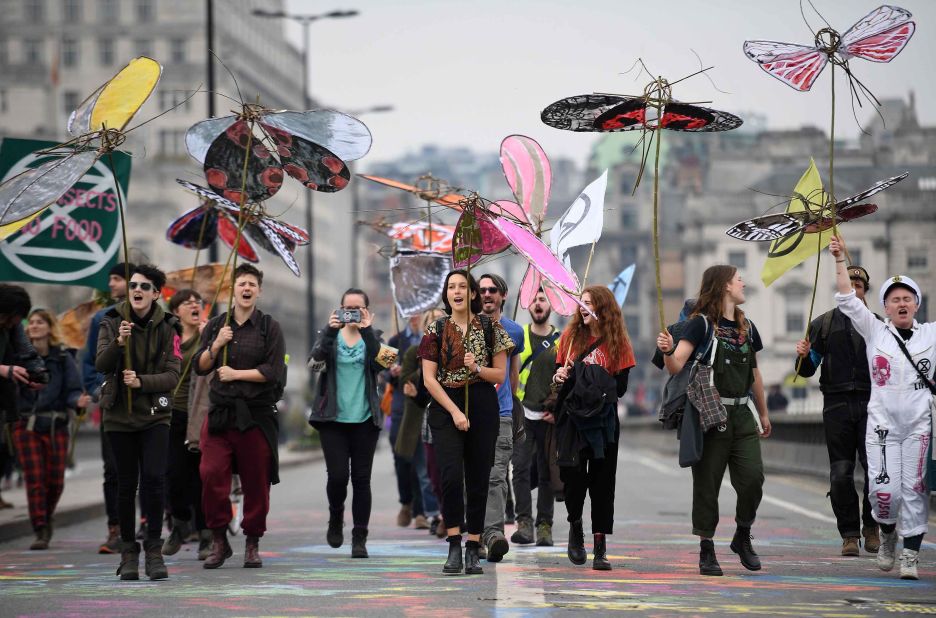 Activists carry model insects as the demonstrate on Waterloo Bridge on April 16.