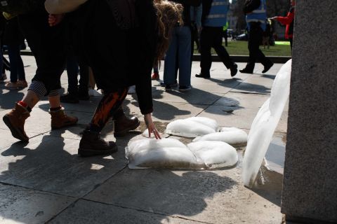 Ice blocks shaped as life vests melt in the sun as members and supporters of Extinction Rebellion rally in Parliament Square on April 15.