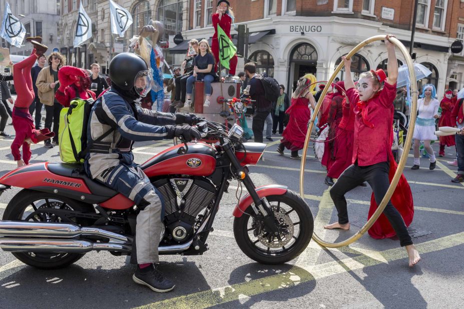 Protesting acrobats block traffic in London on April 15.