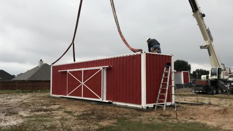 Stores will be made from two shipping containers and feature tile floors, sliding glass doors and a canopy over the roof.