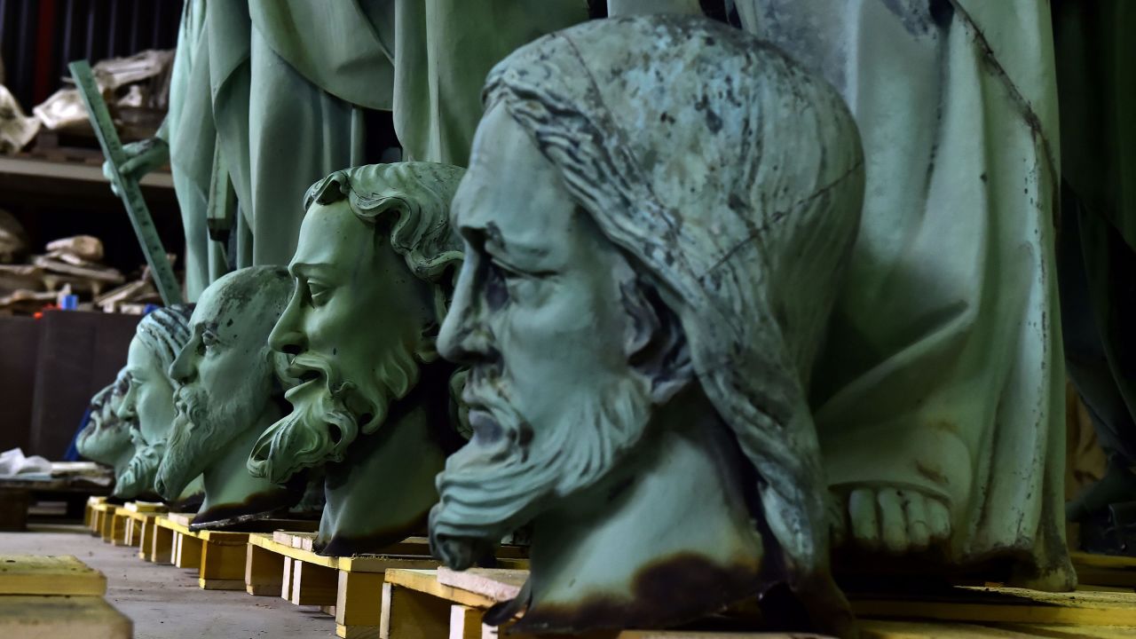 A picture taken in Marsac-sur-Isle near Bordeaux on April 16, 2019 shows the heads of statues which sat around the spire of the Notre Dame Cathedral in Paris, stored in the  Socra workshop before restoration.