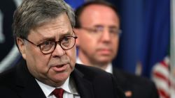 WASHINGTON, DC - APRIL 18: U.S. Attorney General William Barr speaks about the release of the redacted version of the Mueller report as U.S. Deputy Attorney General Rod Rosenstein listens at the Department of Justice April 18, 2019 in Washington, DC. Members of Congress are expected to receive copies of the report later this morning with the report being released publicly soon after. (Photo by Win McNamee/Getty Images)