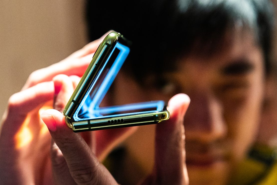 An attendee holds a Samsung  Galaxy Fold device during an unveiling event in New York.