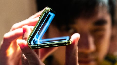 An attendee holds a Samsung  Galaxy Fold device during an unveiling event in New York.