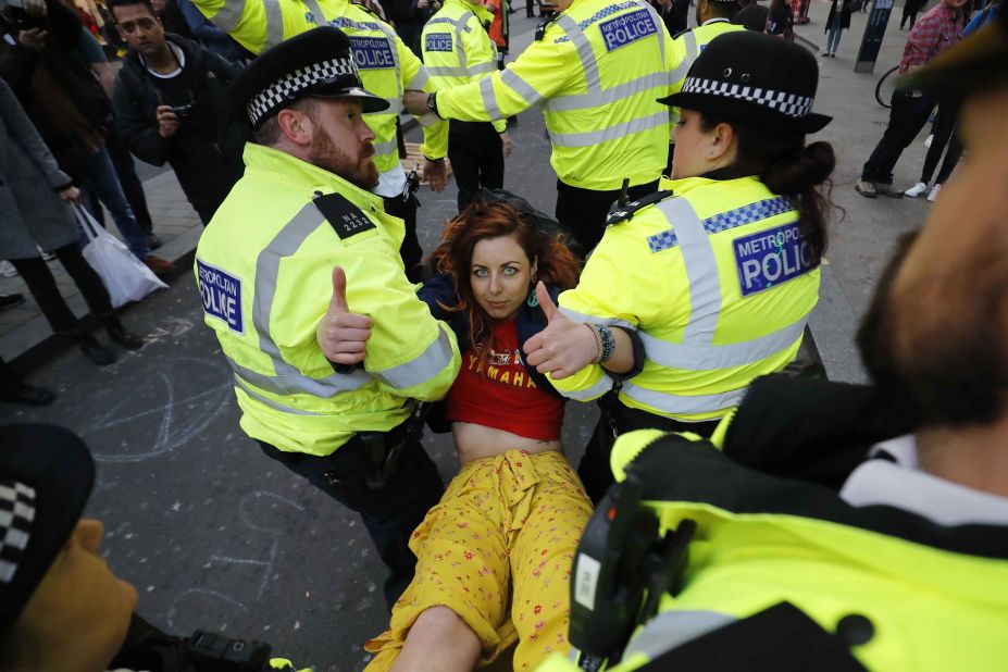 Police carry a protester away from Oxford Circus on April 17.