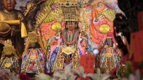 A statue of the goddess Mazu (front) is displayed in Jenn Lann Temple following its return after being carried in a sedan chair on the nine day Mazu pilgrimage on April 23, 2018 in Dajia near Taichung, Taiwan.