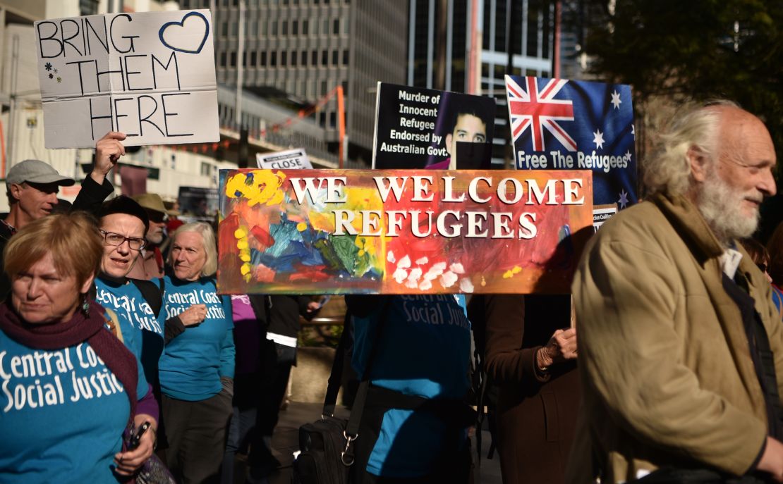 Demonstrators march during a protest to demand humane treatment of asylum seekers and refugees, in Sydney, Australia, on July 21, 2018. 