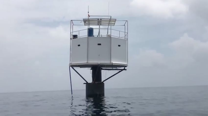A still photo take from video footage posted to Facebook by the Thai Navy shows the sea home that a US man built off the coast of Thailand. The man faces the death penalty after the Thai government deemed him to be unlawfully living in Thai waters.