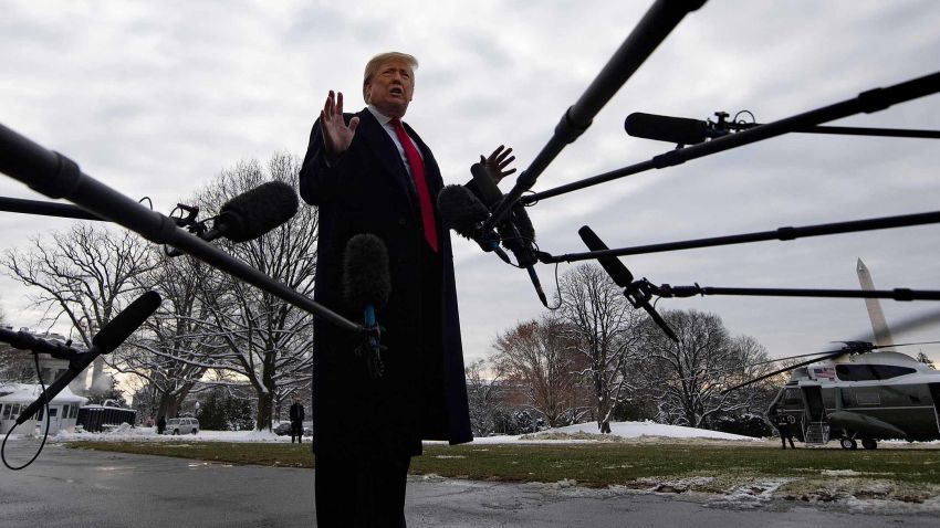US President Donald Trump speaks to the media as he departs the White House in Washington, DC, on January 14, 2019 en route to New Orleans, Louisiana to address the annual American Farm Bureau Federation convention. - US President Donald Trump said Monday he has "never worked for Russia," assailing reports that raised questions about his ties to Vladimir Putin as a "big fat hoax."Trump's comments to reporters at the White House followed a Washington Post report over the weekend that said the president has kept his top aides in the dark about his private conversations with the Russian leader. (Photo by Jim WATSON / AFP)        (Photo credit should read JIM WATSON/AFP/Getty Images)