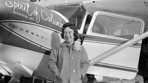 Jerrie Mock, smiling in the bright sunshine that flooded Port Columbus Airport today, is pictured before the start of her attempt at becoming the first woman to fly around the world alone, March 19, 1964. The Columbus housewife headed toward Bermuda on the first leg of the flight to establish two aviation records. (AP Photo/Gene Smith)