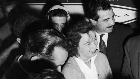 Mock, surrounded by reporters upon her arrival in Egypt.