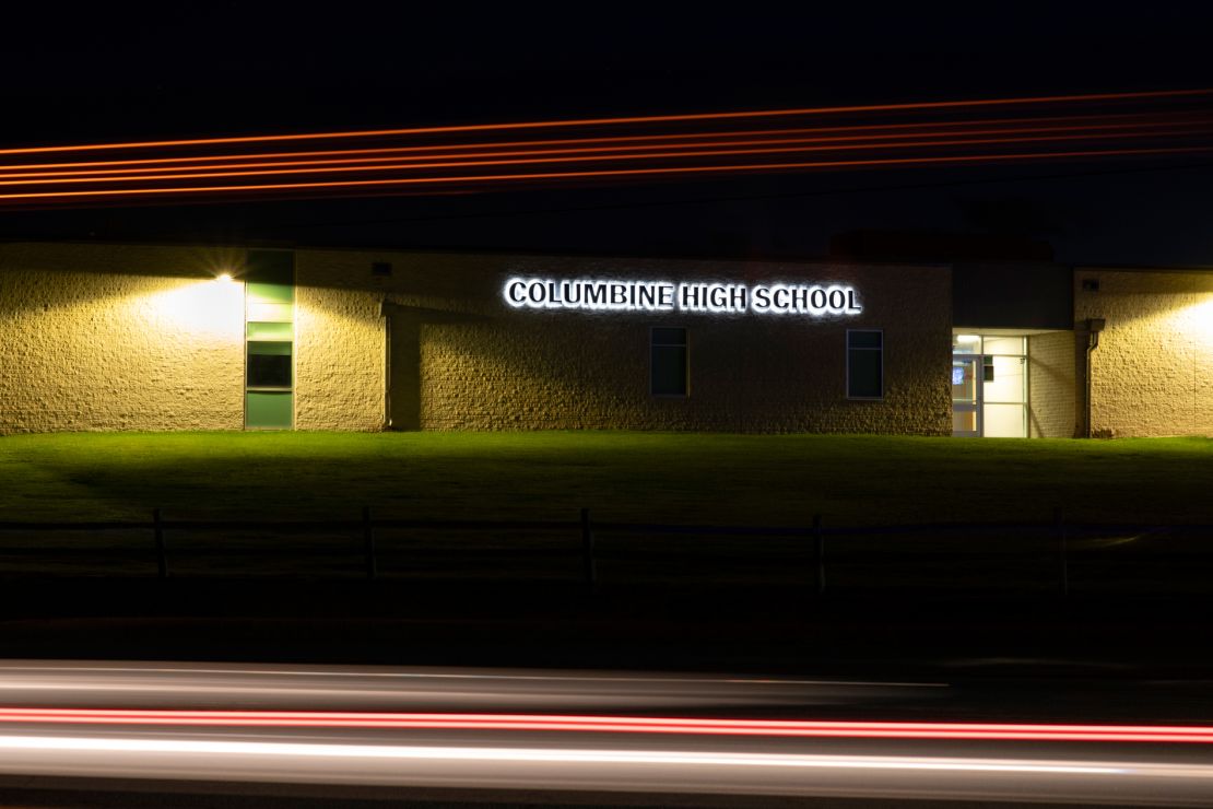 Lights streak as a truck drives by Columbine High School in Littleton, Colorado, in this long-exposure photograph.