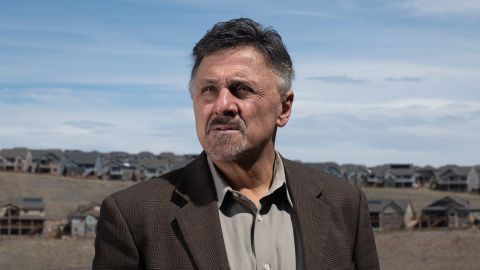 Frank DeAngelis stands outside his home.
