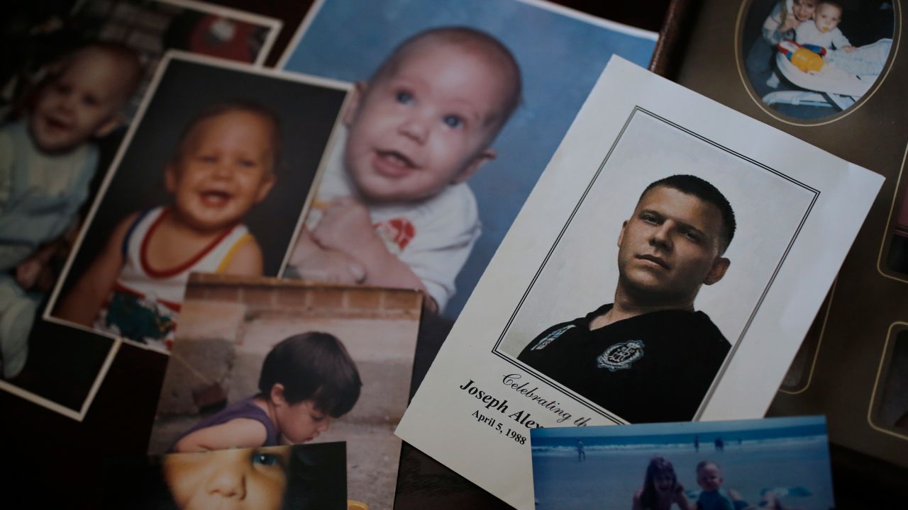 Jennifer Alba goes through old photographs of her son, Joseph, at her home in Apex, North Carolina.