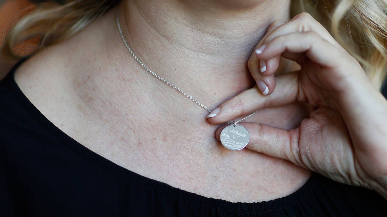 Jennifer Alba shows off a necklace with son Joseph's fingerprint.