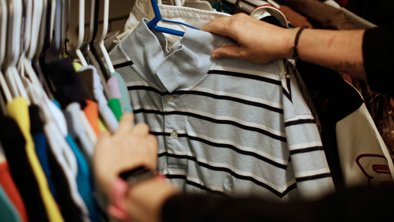 Jennifer Alba looks through a closet full of old clothes belonging to her son, Joseph.