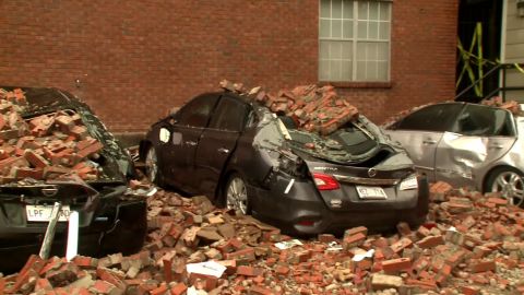 Storm rips brick facade off apartment building in Mississippi.