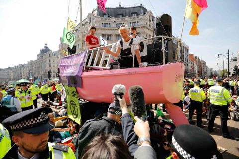 British actress Emma Thompson talks to members of the news media on Friday, April 19, from atop a boat being used by climate activists to blockade the Oxford Circus junction in central London.