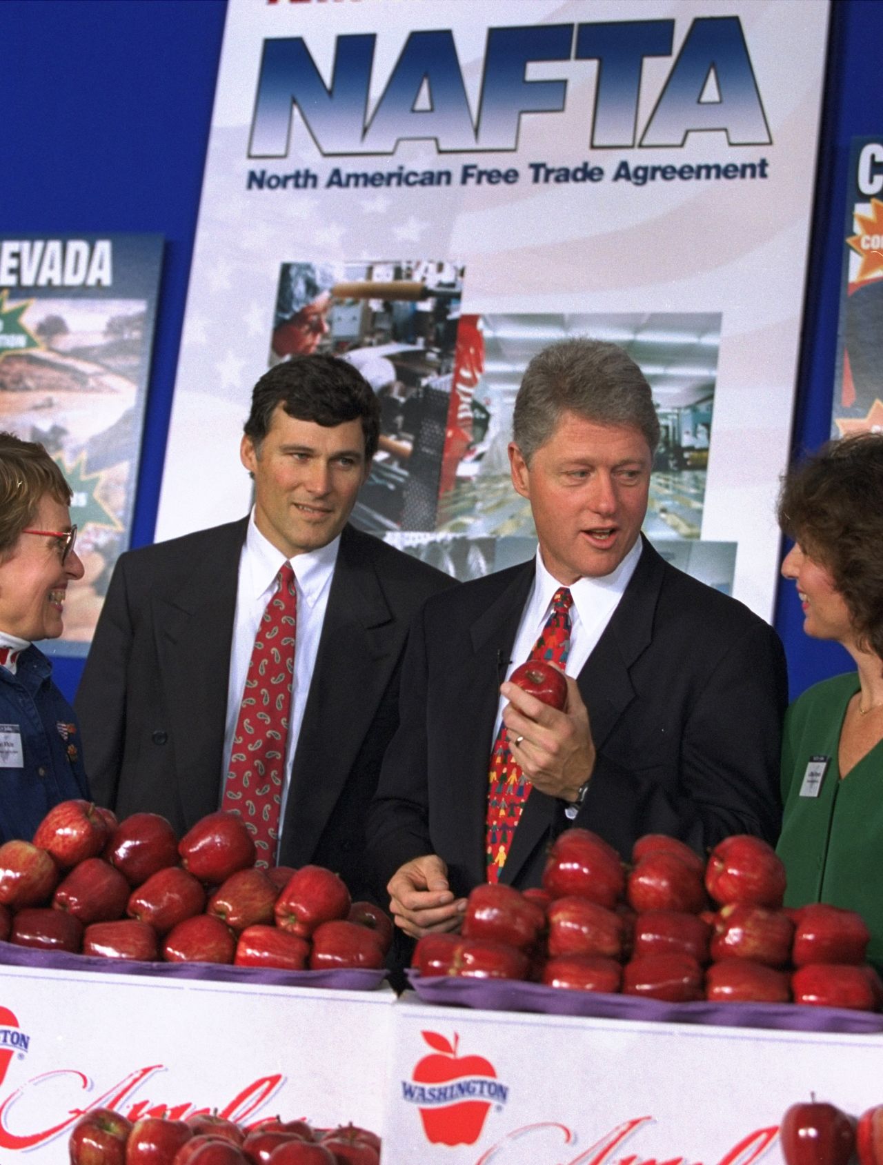 Inslee stands next to President Bill Clinton as they attend a trade fair at the White House in 1993. Inslee was elected to Congress in 1992 after serving several years in the Washington state legislature.