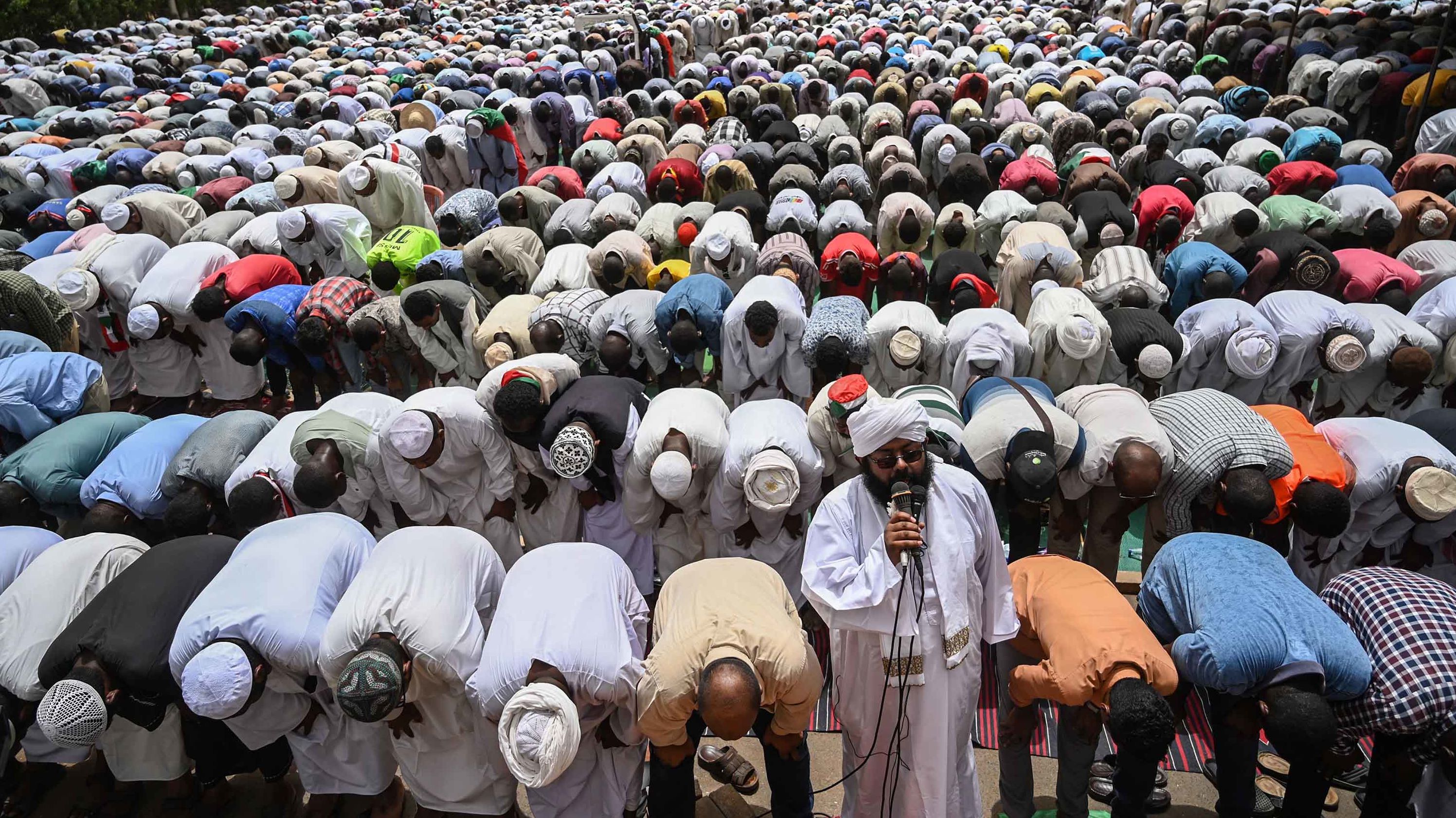 Demonstrators attend Friday prayers outside the army headquarters on April 19.