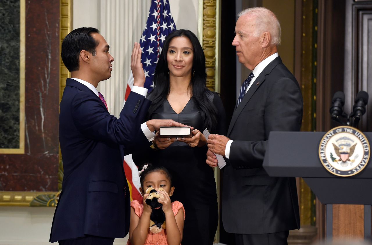 Castro is joined by his wife as he is ceremonially sworn in by Biden in August 2014.