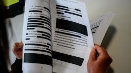 A journalist reads a redacted court filing from the Special Council Robert Mueller in the Paul Manafort case on April 16, 2019. - The final report from Special Counsel Robert Mueller's Russia investigation on April 18, 2019, could leave much of the public unsatisfied because it could be heavily redacted, stripped of significant evidence and testimony that the investigators gathered. Attorney General Bill Barr made clear he will edit out large parts of Mueller's 400-page final report on his investigation of President Donald Trump and Russian election meddling. (Photo by Eric BARADAT / AFP)        (Photo credit should read ERIC BARADAT/AFP/Getty Images)